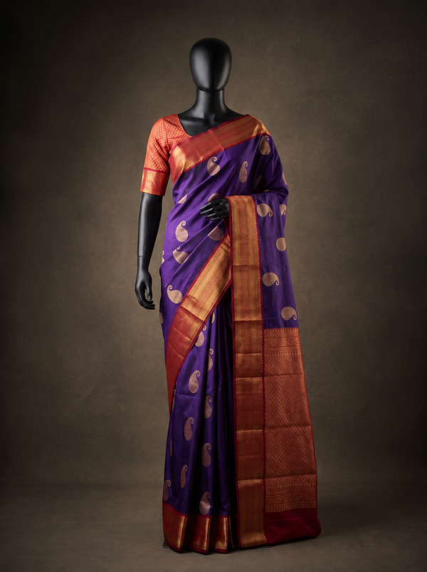 Mugdha Royal Purple Semi Kanchipuram Silk Saree with Red Gold Zari Border & Paisley Buttas
