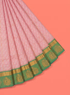 Soft Pink Silk Saree with Intricate Geometric Woven Texture and Ornate Floral Zari Detailing