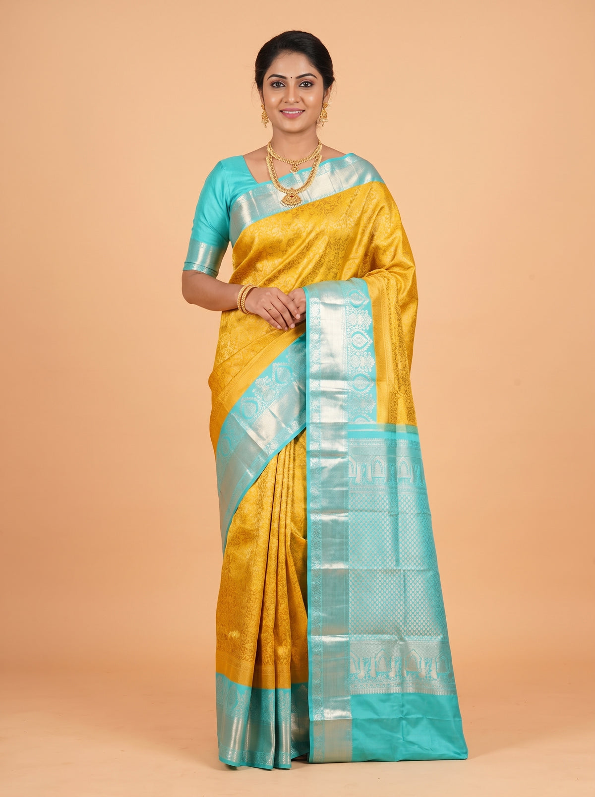Yellow Kanchipuram Saree with Silver Zari Peacock Border