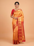 Yellow Kanchipuram Saree with Paisley and Floral Vine Zari Border