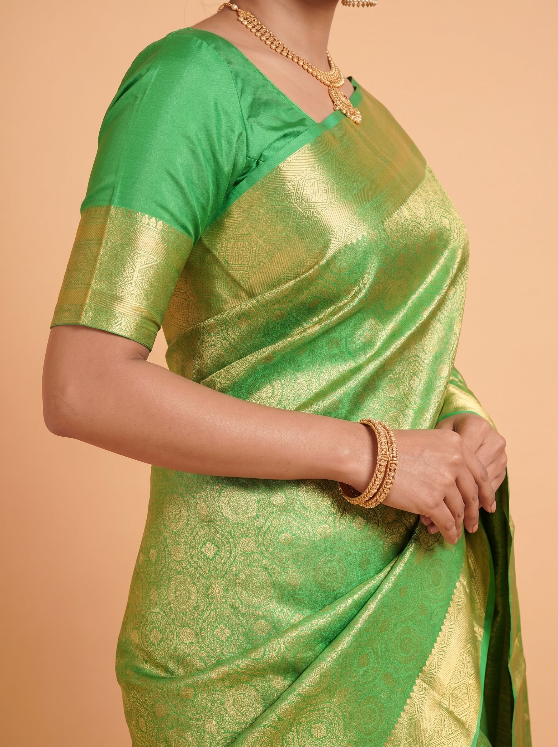 Emerald Green Silk Saree With Intricate Antique Gold Zari Buta & Rich Pallu