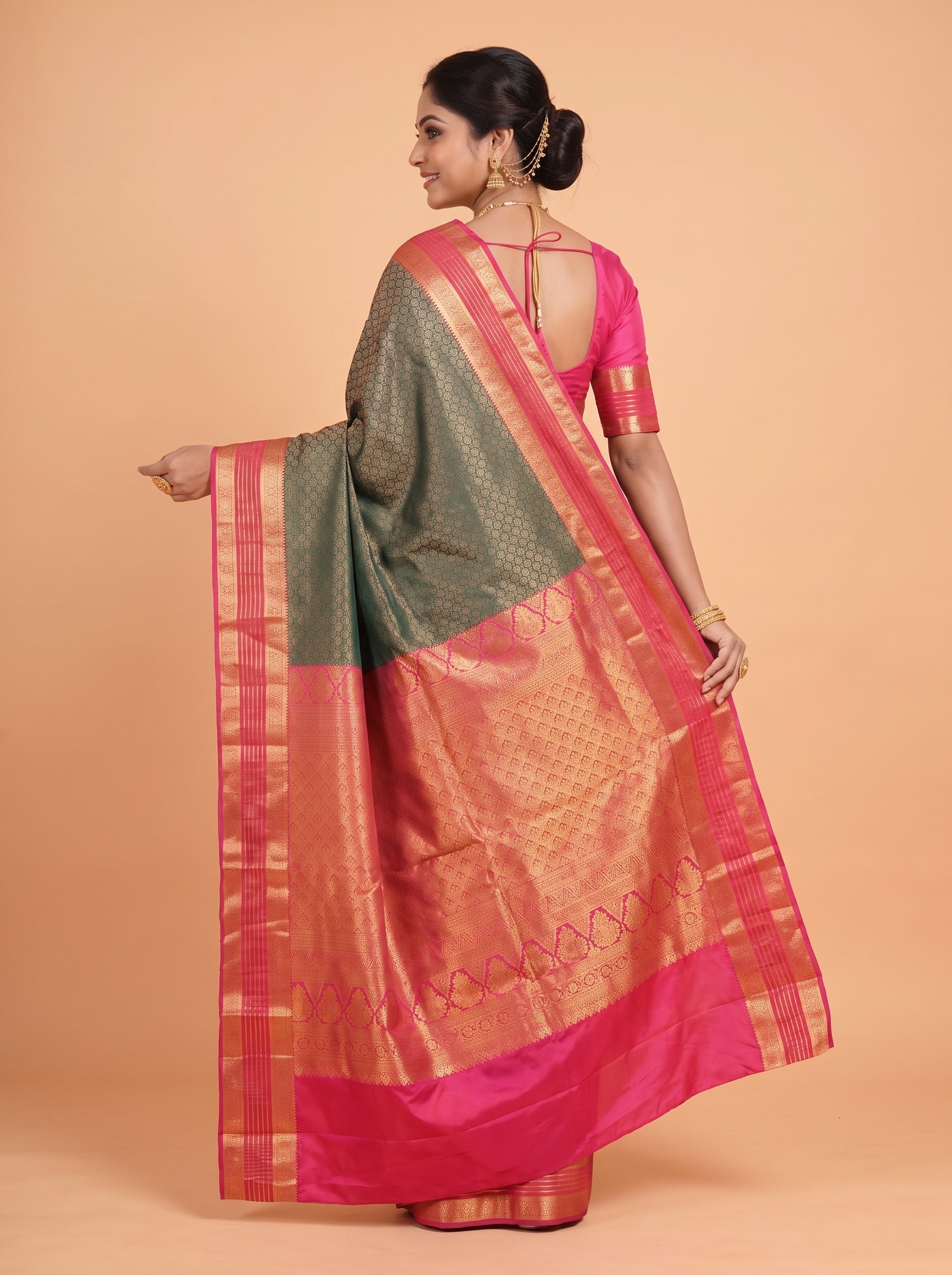 Teal  Green  Silk  Saree  With  Rani  Pink  Pallu  Intricate  Gold  Zari