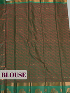 Soft Pink Silk Saree with Intricate Geometric Woven Texture and Ornate Floral Zari Detailing