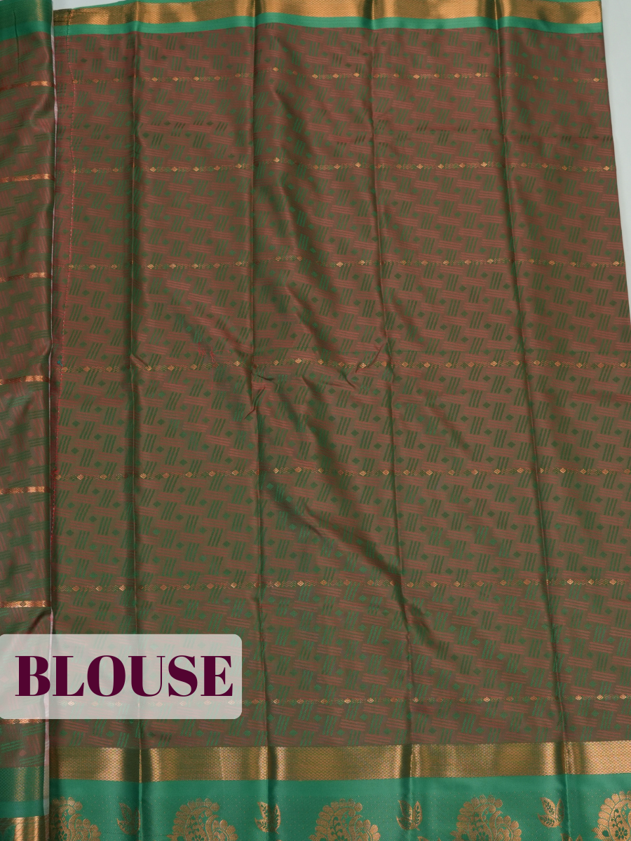 Soft Pink Silk Saree with Intricate Geometric Woven Texture and Ornate Floral Zari Detailing