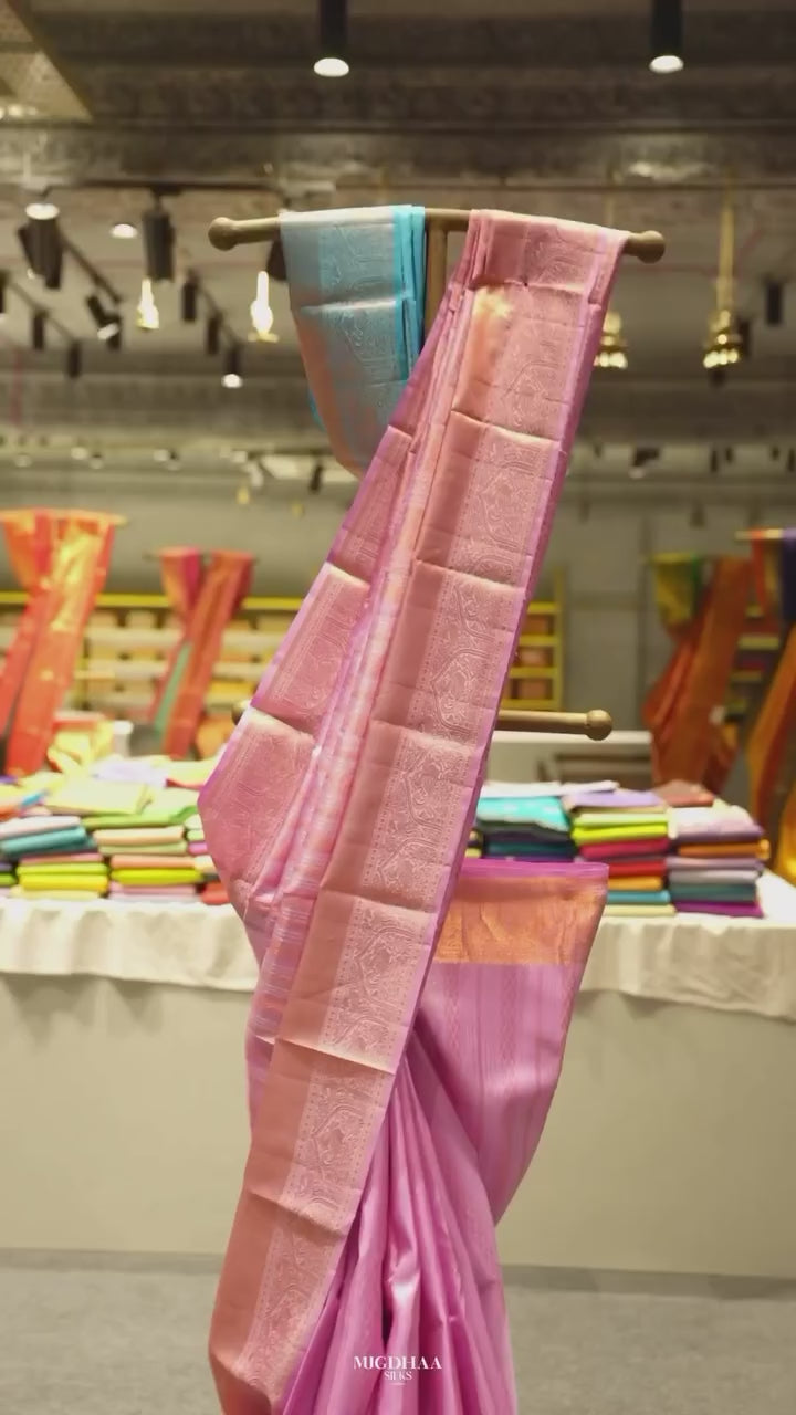 Pink Pure Kanjivaram Silk Saree with A copper-zari peacock and arch brocade border